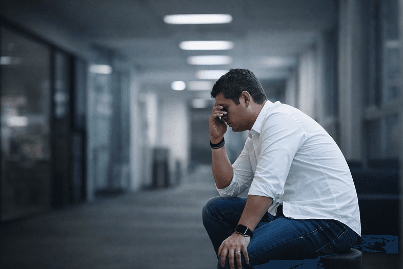 Person looking stressed and overwhelmed