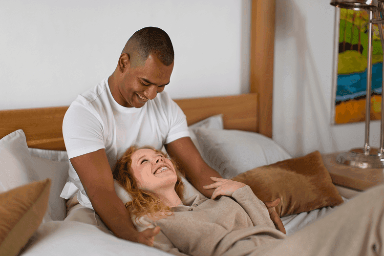 Couple in bed, one partner affected by snoring